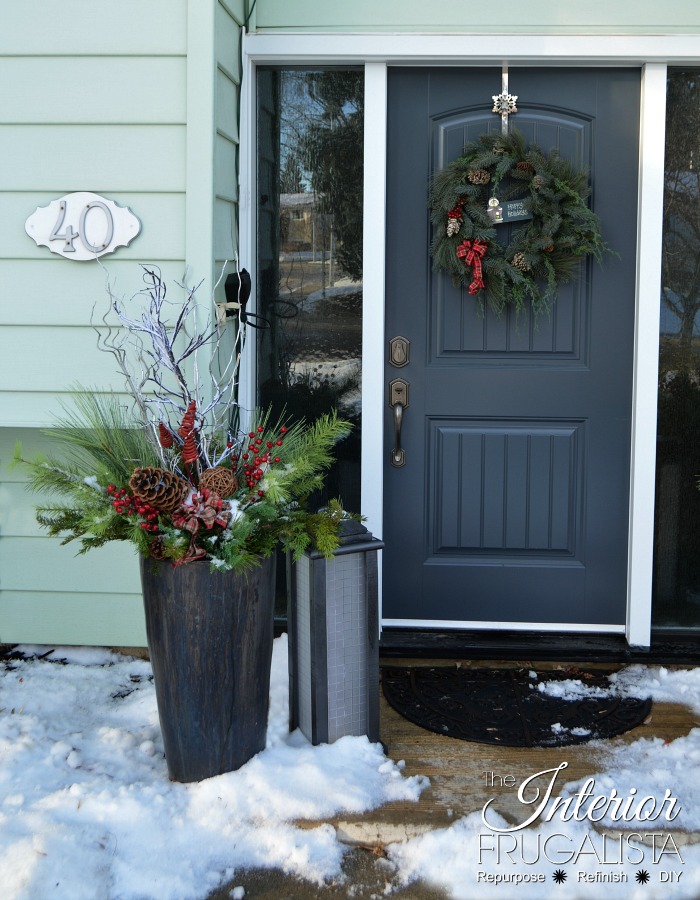 How to make Festive Outdoor Lighted Christmas Planters to flank the front door that don't require watering with artificial greens for DIY holiday decor.