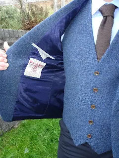 blue tweed jacket and waist coat and brown matching tie