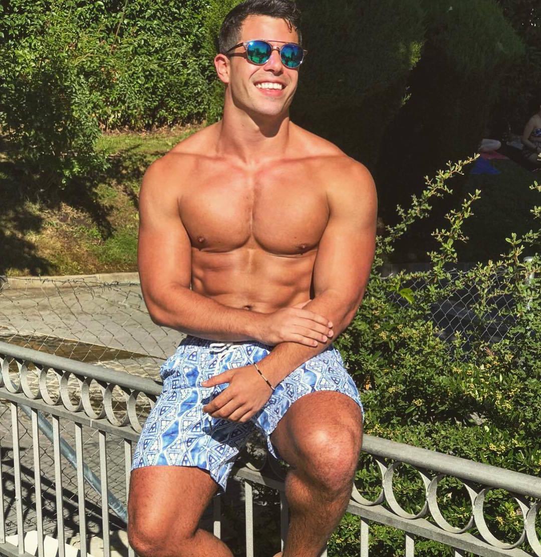 handsome-beefy-shirtless-muscle-guy-smiling-sunglasses