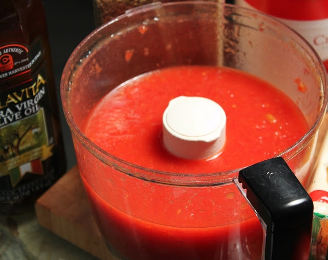 this is pureed tomatoes and olive oil in a food processor