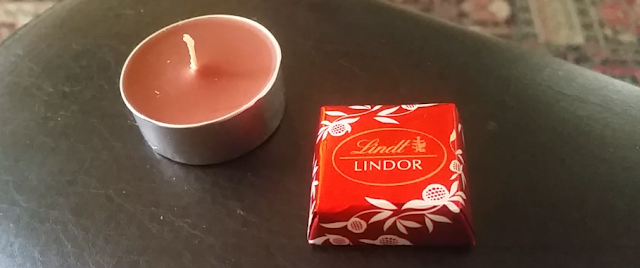 A tealight candle and chocolate out of my advent calendar