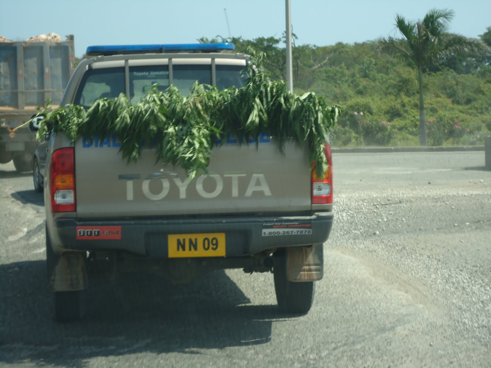 Jamaican police patrolling a beach area