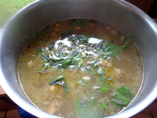 Add chickpeas; simmer, stir in basil and Parmesan.