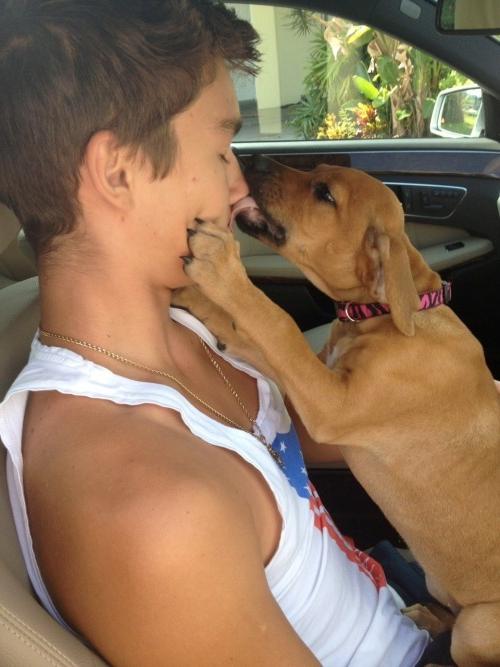 adorable-boy-pet-dog-licking-face-car
