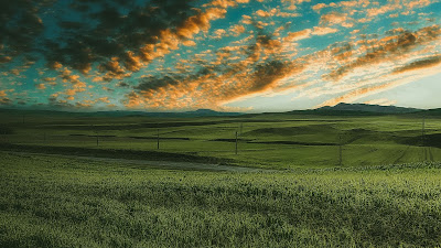 Grass field, road, clouds, sky Grass field, road, clouds, sky