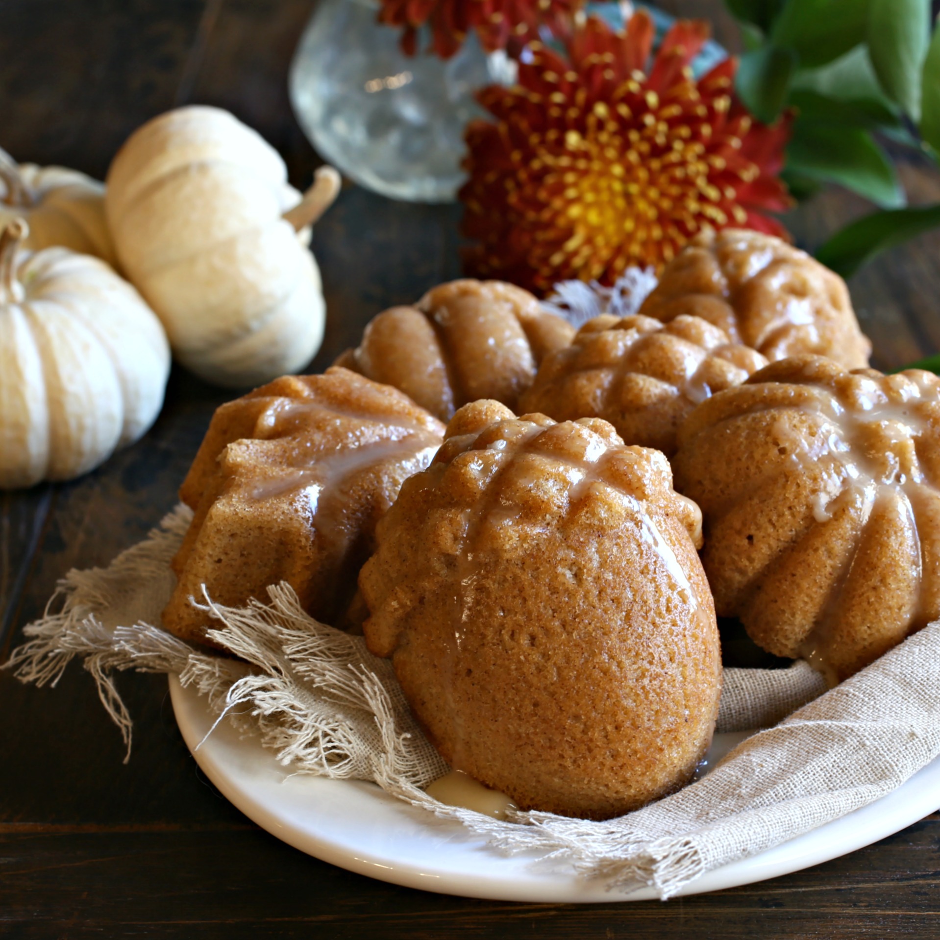 Recipe for lightly spiced cinnamon and ginger mini cakes with a maple glaze.