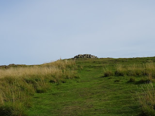 A picture of a grassy slope which is a view up to the summit of Traprain Law in East Lothian.  Picture by Kevin Nosferatu for the Skulferatu Project.