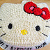 Hello Kitty Cake: a chocolate cake with chocolate mousse and buttercream frosting.