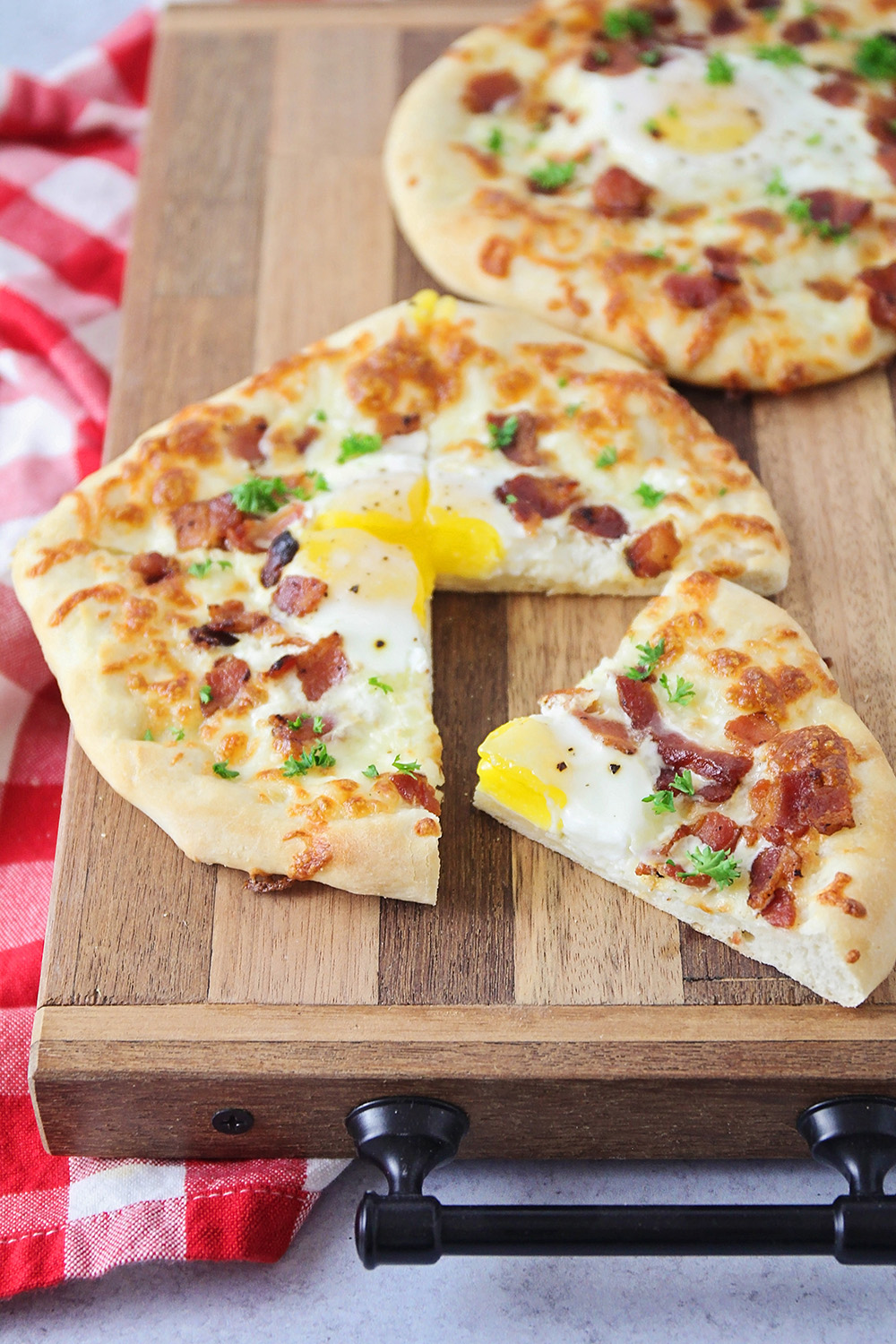 These mini bacon breakfast pizzas are so delicious and flavorful, and perfect for breakfast, lunch, or dinner!