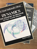 Dynamics: The Geometry of Behavior, by Ralph Abraham and Christopher Shaw, superimposed on Intermediate Physics for Medicine and Biology.