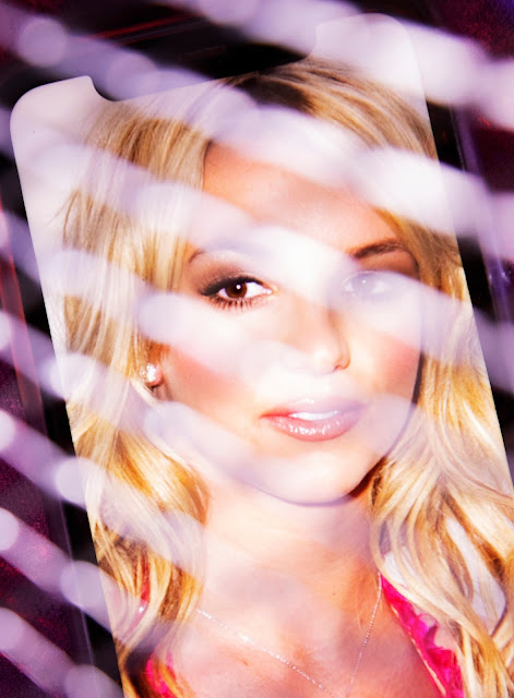 Britney Spears appears on a phone behind a series of blurred lines