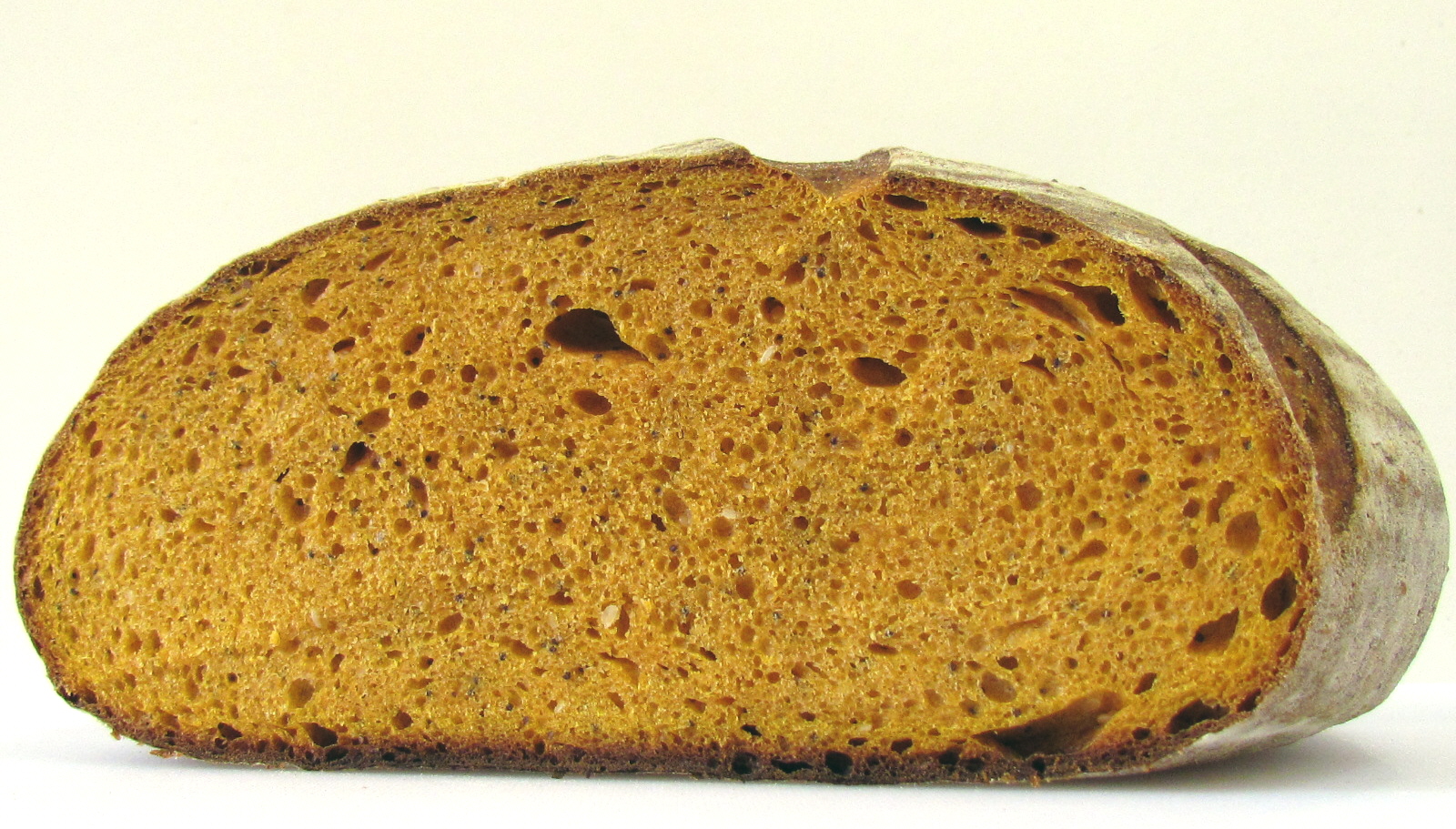 Подовый хлеб это какой. Хлеб на закваске. Тыквенный хлеб. Хлеб подовый с семенами. Хлеб с семенами тыквы и подсолнечника.