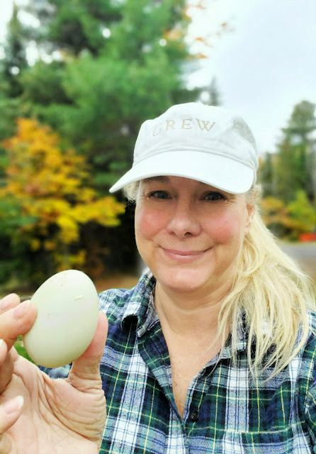 woman smiling with duck egg