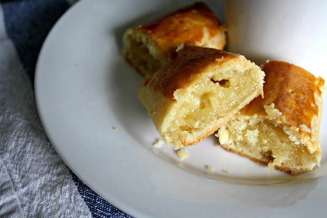 A piece of cake on a plate, with Almond and Dough