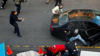 Man drives car against Seattle protest crowd and shoots defender