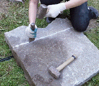 cutting stone with hammer and chisel