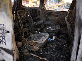 inside of heavily damage burned vehicle in Mong Kok