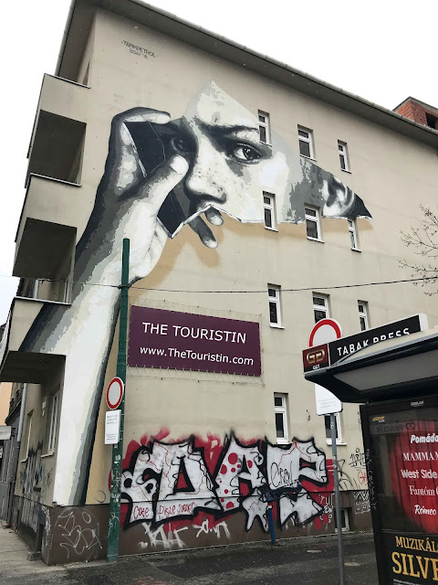 Paste Up Mural of a face on a house facade created during the Street Art Festival in Bratislava in Slovakia