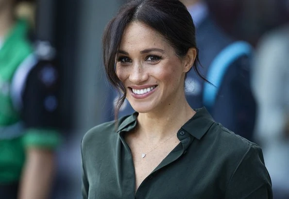 Meghan Markle wore Emporio Armani cashmere coat, & Other Stories silk shirt, Boss leather skirt, Gianvito Rossi pumps and carried Gabriela Hearst bag