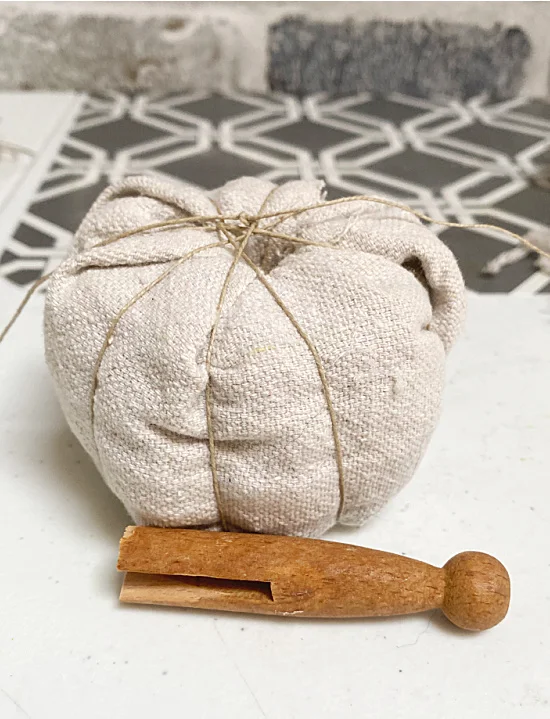 wrapped pumpkin and clothespin
