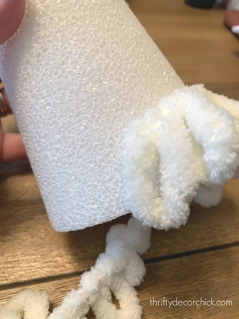 Adding fluffy yarn to foam cones