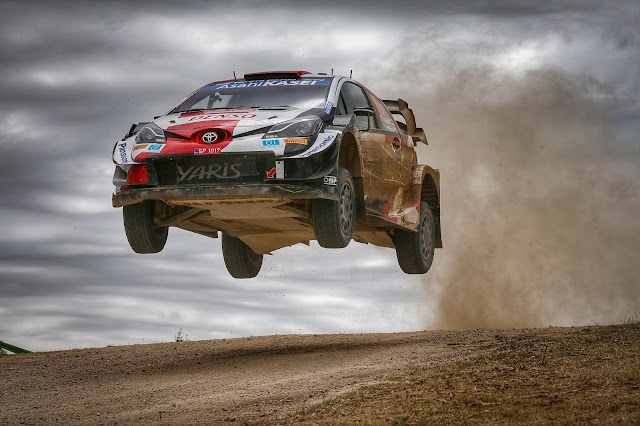 Rally Driver Sebastien Ogier jumping to victory