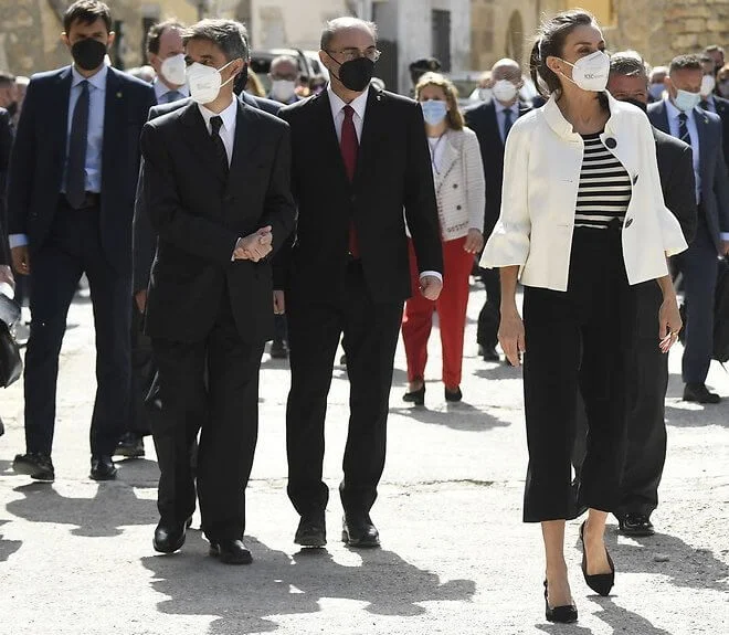 Queen Letizia wore a stripe wool sweater and trousers from Hugo Boss, and new black maysli suede slingback pumps from Manolo Blahnik