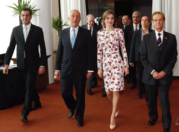 Queen Letizia wore Zara wool coat in red, Carolina Herrera Floral Dress and Lodi Saray Pumps at European Conference in Porto 