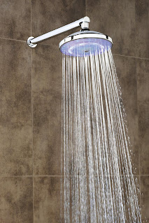 A shower head shooting out water