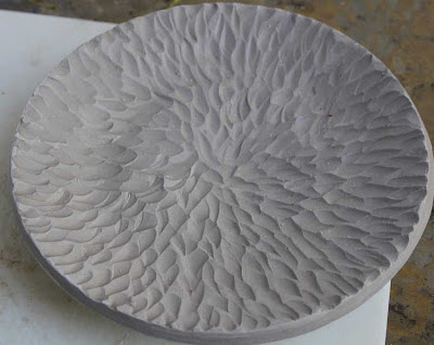 carved pottery plate