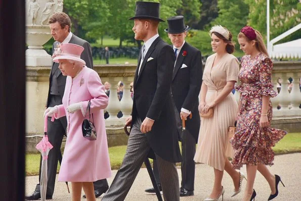 Princess Eugenie wore Sandro wrap dress. Princess Beatrice wore The Vampire's Wife floral-print silk dress. Duke of Sussex