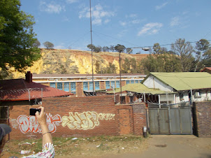 Artificial yellow coloured hills formed from "Gold Mine" waste mud.