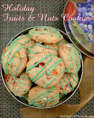 Holiday Fruits and Nuts Cookies, packed with toasted nuts and dried fruits, topped with a colored drizzle, these cookies are a fun holiday treat. | recipe developed by www.BakingInATornado.com | #recipe #cookies