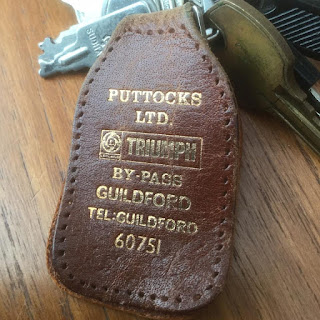 Puttocks Ltd brown leather key fob with Triumph branding
