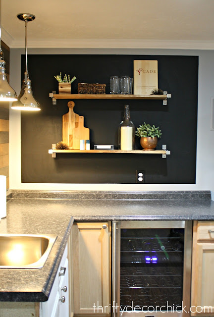 Chalkboard wall with wood shelves