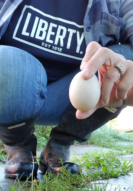 woman holding duck egg