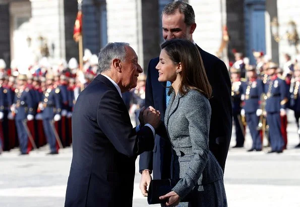 Queen Letizia wore Felipe Varela skirtsuit, and Magrit Pumps and carried Magrit clutch bag. Queen Letizia will hold a gala dinner at Royal Palace