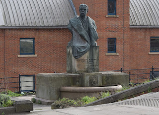 William Coulson Statue in front of modern Quayside flats