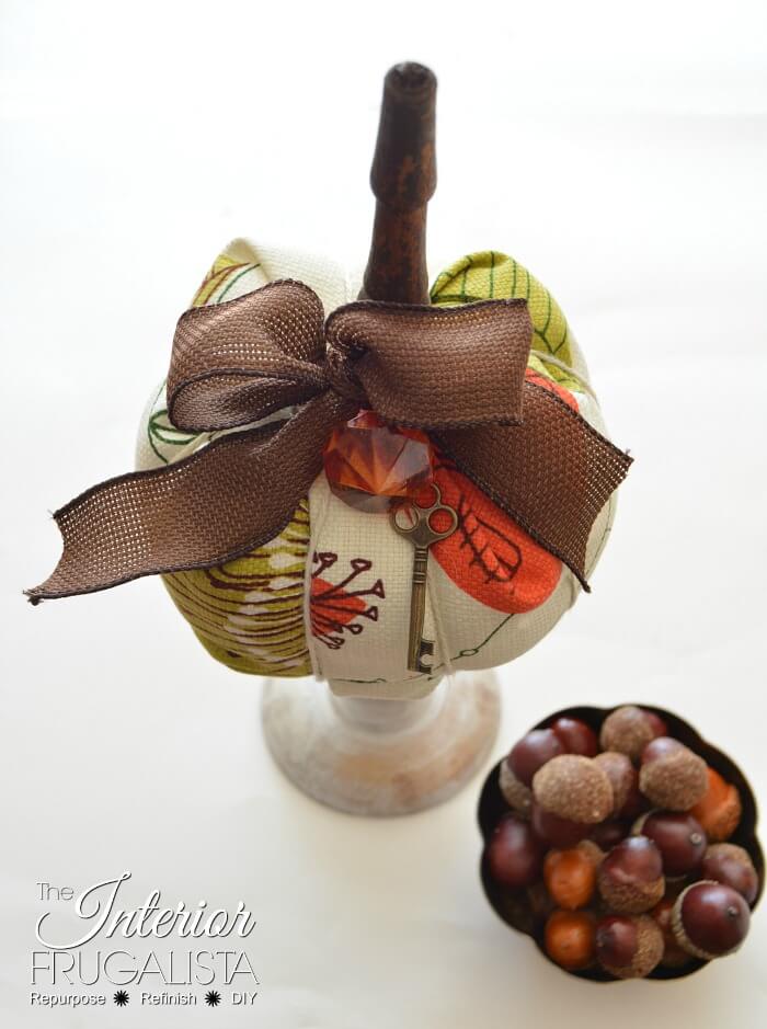 Funky DIY retro fabric pumpkins with chair spindle stems that have unique bold mid-century modern style and a vintage 70s autumn color palette.