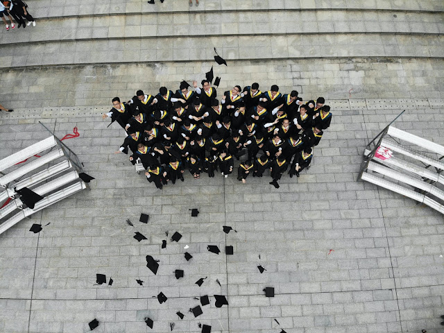 MBA Students celebrating after graduating from a prestigious college in Singapore
