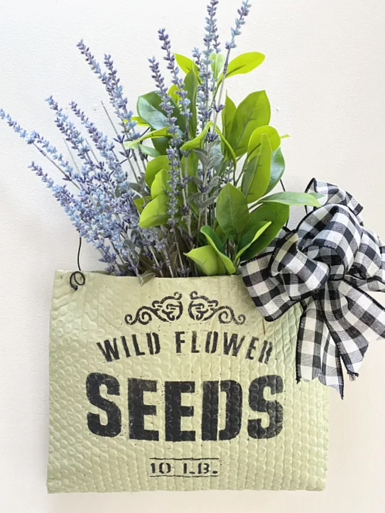 flower basket with a bow and faux flowers