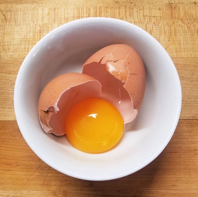 egg cracked into bowl