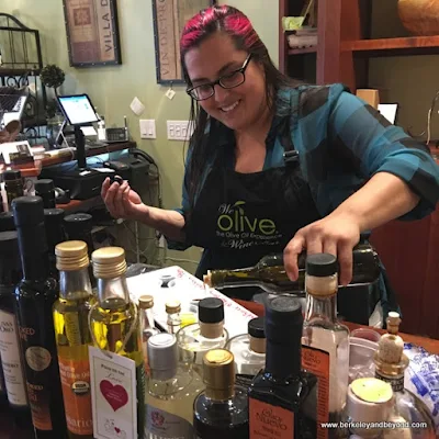 Sara Bega pours a taste at We Olive & Wine Bar in Los Gatos, California