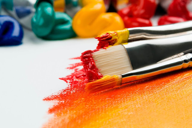 professional art brushes dipped in paint