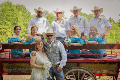 cowgirl and cowboy wedding party with burlap flowers