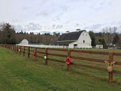 Barn fence posts decorated for Christmas