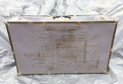 scratched up top of an old suitcase