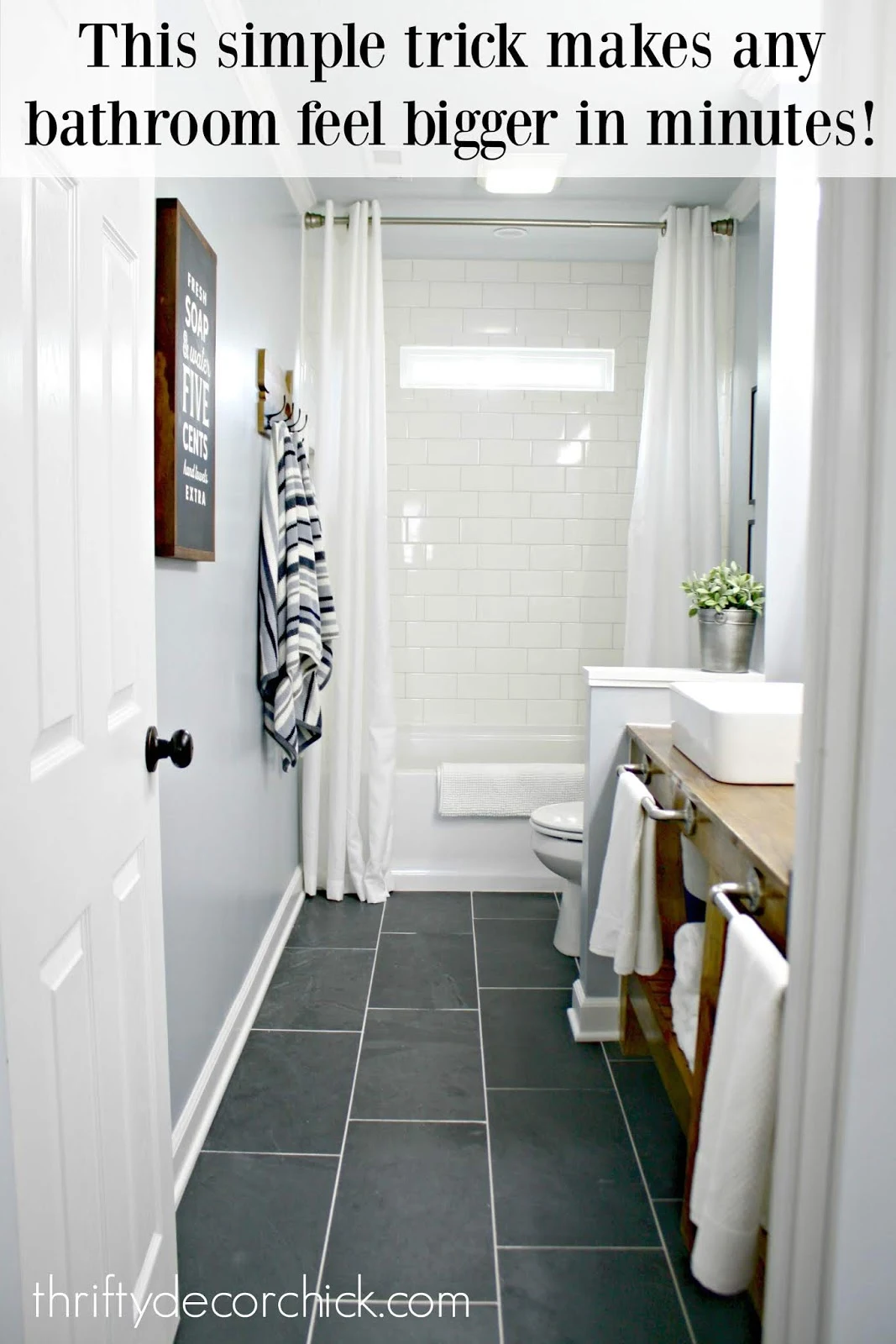 Raise shower curtain to make bathroom feel bigger