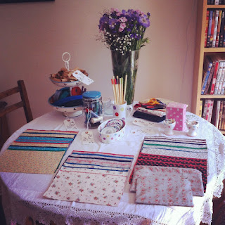 Table set up for sewing workshop at the hen party with material and zip options