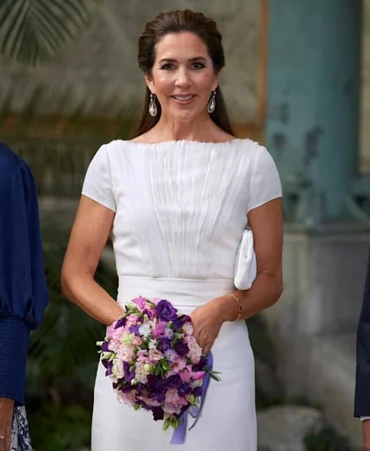 Crown Princess Mary wore a white dress by David Andersen, and snowdrop earrings by Dulong Fine Jewelry